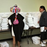 Two delegates from the sixth session of the Permanent Forum on Indigenous Issues (UNPFII) with conference documents